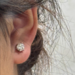 woman wearing moissanite drop earrings 6 prong setting everyday look