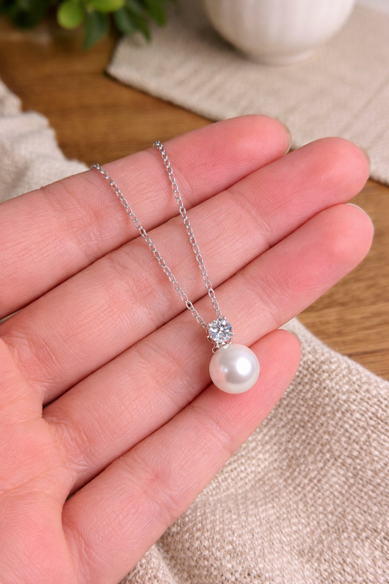 woman wearing pearl drop necklace with 0.5ct moissanite elegant daily look