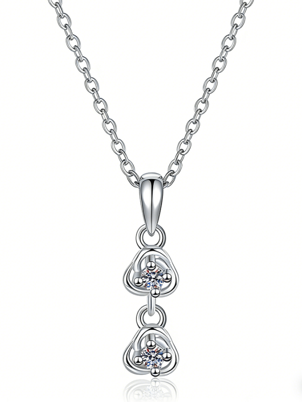 Close-up of a model wearing the 2mm moissanite Side by Side™ pendant from The Promise Moissanite You & Me Series.